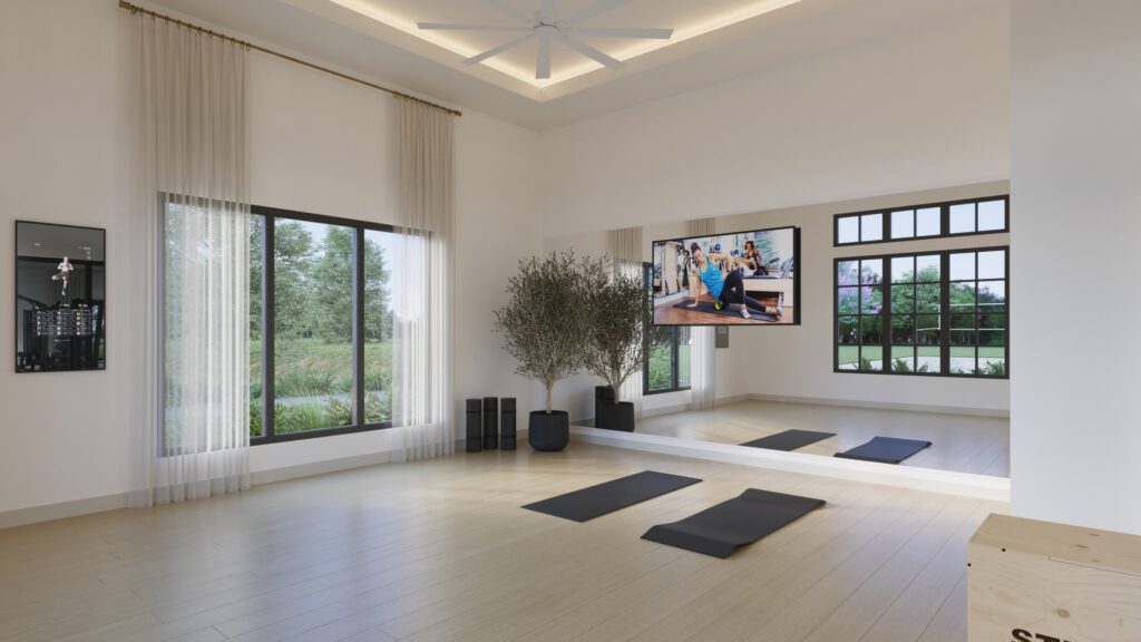 Bright, minimalist yoga studio with wood flooring, yoga mats, a wall-length mirror, and a wall-mounted fitness display screen