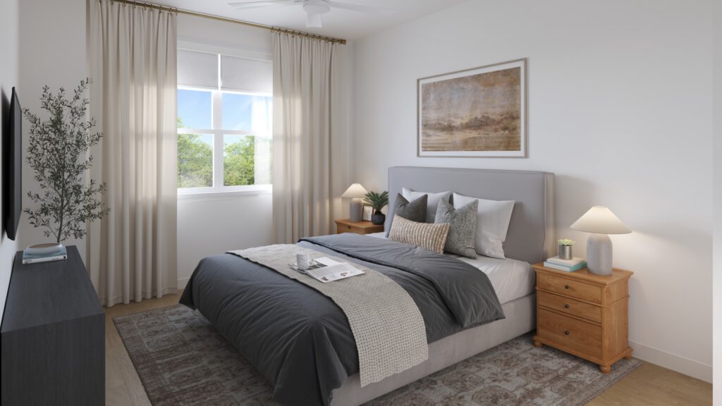 Cozy bedroom with gray and white bedding, wooden nightstands, and large window